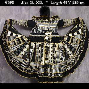 May include: A black, white, and yellow hooded coat featuring a patchwork design with various patterns including houndstooth, floral, and geometric prints. The coat is labeled #593, size XL-XXL, and has a length of 49 inches with ruffled trim edges.