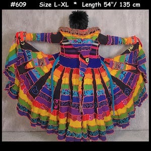 May include: A long-sleeved coat with a hood, featuring a vibrant patchwork design of horizontal stripes in rainbow colours including red, orange, yellow, green, blue, and purple. The garment is labelled #609, size L-XL, and 135 cm in length.
