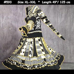 May include: A black, white and yellow hooded coat featuring a patchwork design with various geometric and floral patterns. The garment includes a long pointed hood, ruffled edges, and is labelled #593, size XL-XXL, with a length of 125 cm.