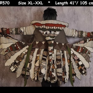 May include: A long, multi-colored patchwork cardigan with a hood. The cardigan is made of different types of knit fabric and has a frayed, layered hem. The cardigan is size XL-XXL and is 41 inches long.