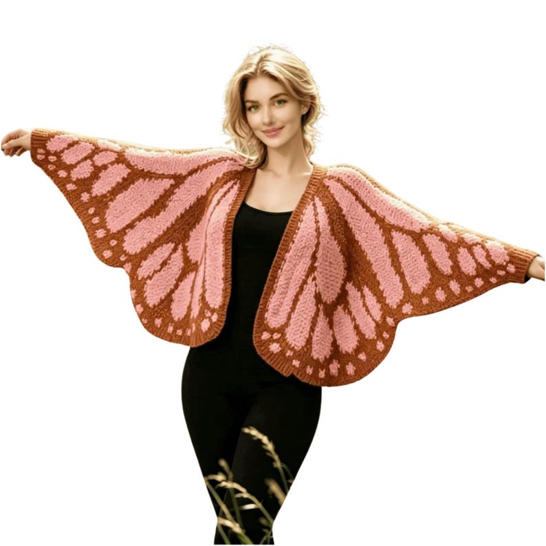 May include: A knitted butterfly wing-shaped cardigan in shades of pink and brown. The open-front sweater features a detailed wing pattern, with a brown border and pink interior. The sleeves extend to create the wing shape, perfect for a whimsical look.