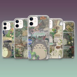 May include: Five clear phone cases featuring the animated character Totoro. Each case has a different design, including images of Totoro, forest scenes, and Japanese text. The cases are made of clear plastic.
