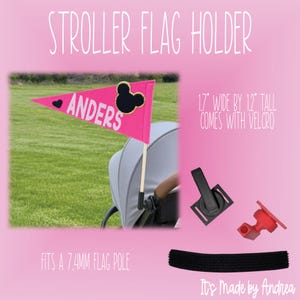 May include: A pink stroller flag with the name "Anders" and a black Mickey Mouse head design. The flag is 1.7 inches wide by 12 inches tall and comes with Velcro. The image also shows a black stroller attachment and a red piece.