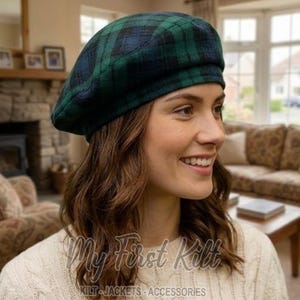 May include: A beret featuring a dark green and navy blue plaid tartan pattern. The hat has a rounded, soft crown and a structured band that sits comfortably around the head. The fabric displays a woven texture with intersecting lines.