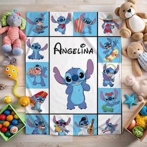 May include: A light blue and white blanket featuring the character Stitch from Lilo & Stitch. The blanket has a grid pattern with various images of Stitch, and the name "Angelina" is displayed in the center.