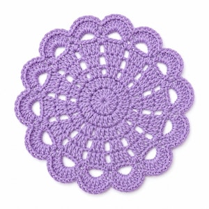 May include: A round, light purple crochet doily featuring a dense, circular center pattern that transitions into an openwork design, finished with a scalloped edge consisting of twelve distinct, rounded, and repeating petal-like loops.