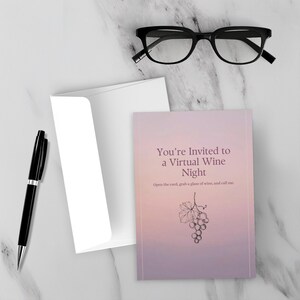 May include: A black ink pen, a white envelope, and a rectangular greeting card with a soft pink and purple gradient background. The card features the text "You're Invited to a Virtual Wine Night" and "Open the card, grab a glass of wine, and call me."