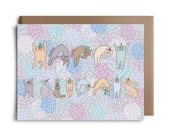May include: A greeting card with a light blue background with a pattern of white and blue circles and white lines. The word "Happy Holidays" is spelled out using a series of cats wearing party hats. The cats are in various colors, including orange, gray, light blue, and pink.