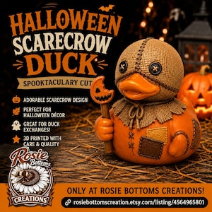 May include: A rubber duck styled as a scarecrow with a burlap-textured head, black button eyes, and an orange beak. It wears a burlap collar and holds a small orange pumpkin lollipop. The body is orange with brown patches and stitched details.