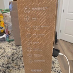 May include: A cardboard box with text and icons, including "18/8 Recycled Stainless Steel", "BPA Free", and "Double Wall Vacuum Insulation". The box has a diagonal striped pattern and the words "Built for Life" at the bottom.