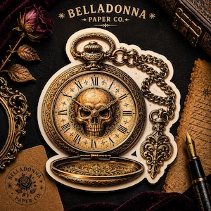 May include: A gold-toned pocket watch sticker featuring a central skull motif on the clock face with Roman numerals. The design includes an ornate chain and a decorative fob. The text BELLADONNA PAPER CO. is printed at the top and on a small card.