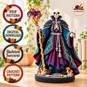 May include: A crochet skeleton sorcerer figure wearing a blue and purple robe with yellow lightning patterns, holding a staff topped with a purple spider. The figure stands on a base with small mushrooms and holds a scroll in one hand.