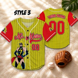 May include: Yellow baseball jersey with red sleeves and pinstripes. Features a Ms. Marvel graphic, the number 00, and the text "Your Name". Includes a baseball glove and a baseball.