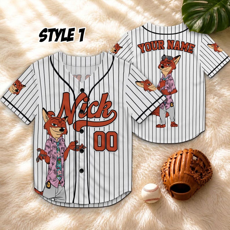 May include: White baseball jersey with black pinstripes, featuring a cartoon fox character and the name "Nick" in orange. The jersey has the number "00" and the text "STYLE 1". A baseball glove and ball are also visible.