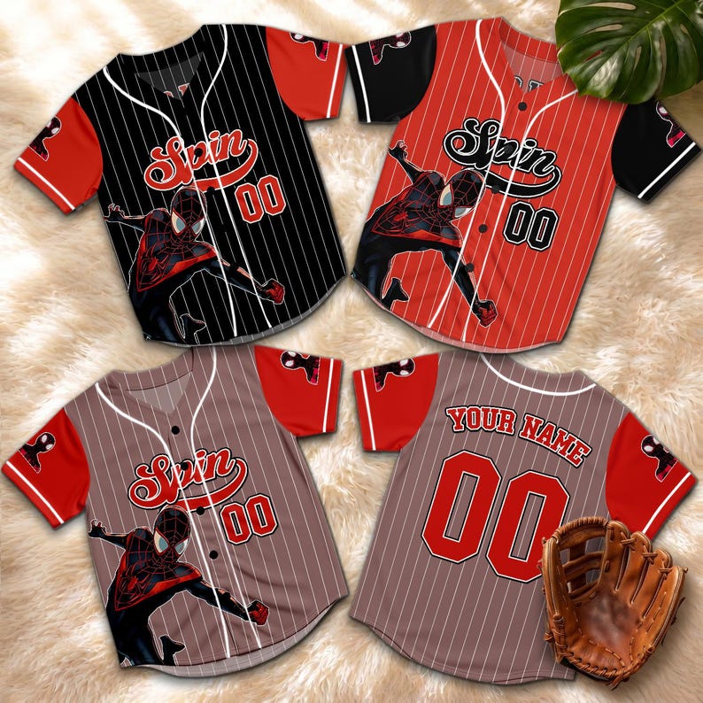 May include: Four baseball jerseys featuring the word "Spin" and the number "00". The jerseys are black, red, and brown with a Spider-Man graphic. A baseball glove is also visible.