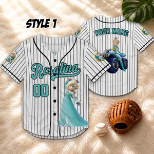 May include: White baseball jersey with black pinstripes, featuring the name "Rosalina" in teal script and the number "00". The jersey has a cartoon image of Rosalina and the text "YOUR NAME" on the back. A baseball glove and ball are in the image.