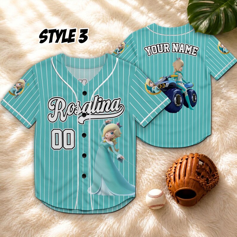 May include: A teal baseball jersey with white pinstripes, featuring the name "Rosalina" and the number "00". The jersey has a cartoon image of Rosalina and the text "YOUR NAME" on the back. A baseball glove and ball are next to the jersey.