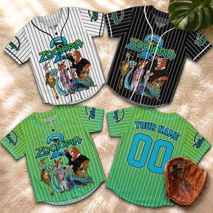 May include: Four baseball jerseys with the "Zootopia" logo and character graphics. The jerseys are white, black, and green with pinstripes. One green jersey has "YOUR NAME" and "00" on the back. A brown baseball glove is also visible.