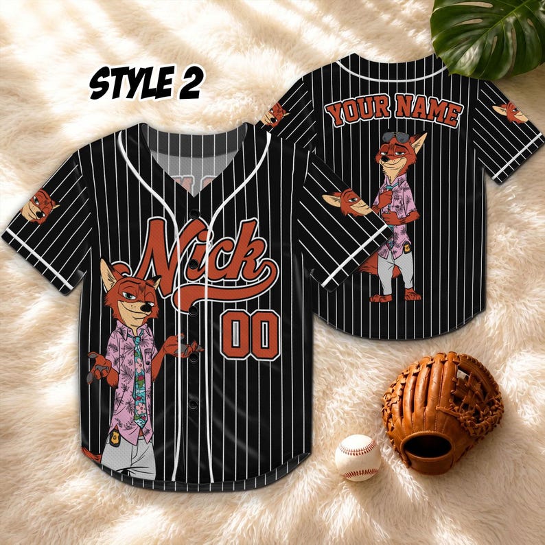May include: Black and white pinstripe baseball jersey with the name "Nick" and the number "00" in orange. The jersey features a cartoon fox character and the text "STYLE 2". A baseball glove and ball are in the image.