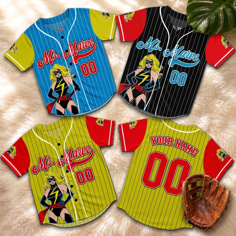 May include: Four baseball jerseys with a Ms. Marvel graphic. The jerseys are blue, black, and yellow with red and yellow accents. Each jersey has the number "00" on it. A baseball glove is also in the image.