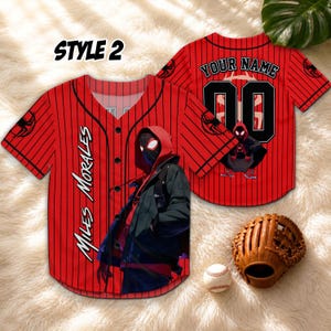 May include: Red baseball jersey with black pinstripes, featuring the text "MILES MORALES" and a graphic of a character. The back of the jersey has the text "YOUR NAME" and the number "00". A baseball glove and ball are also in the image.