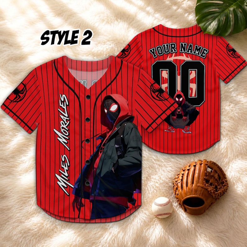 May include: Red baseball jersey with black pinstripes, featuring the text "MILES MORALES" and a graphic of a character. The back of the jersey has the text "YOUR NAME" and the number "00". A baseball glove and ball are also in the image.
