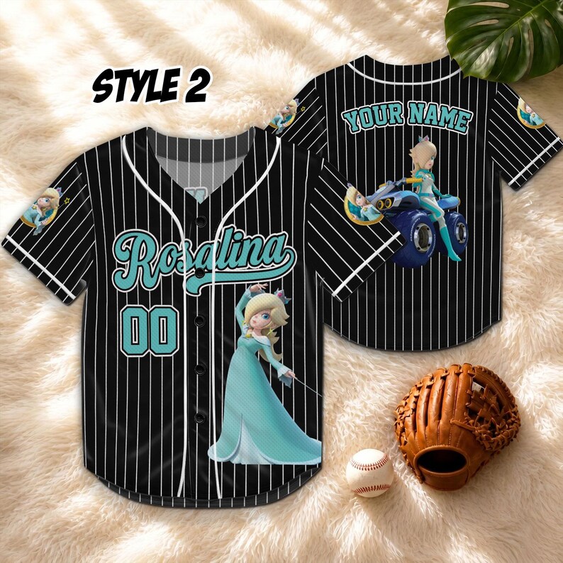 May include: Black and white pinstripe baseball jersey with the name "Rosalina" in teal script and the number "00". The jersey features a cartoon character in a teal dress. The words "YOUR NAME" are on the back of the jersey. A baseball and glove are in the image.