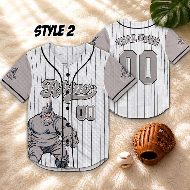 May include: A white and black pinstripe baseball jersey with the word "Rhino" and the number "00" on the front. The jersey features a cartoon illustration of a rhino. The back of the jersey has the number "00" and the text "YOUR NAME".