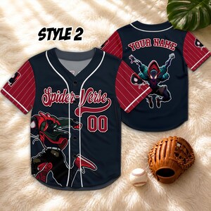 May include: A navy blue and red pinstriped baseball jersey featuring the text Spider-Verse and the number 00 on the front, with a graphic of a character in a hooded suit. The back displays the text YOUR NAME and a character graphic.