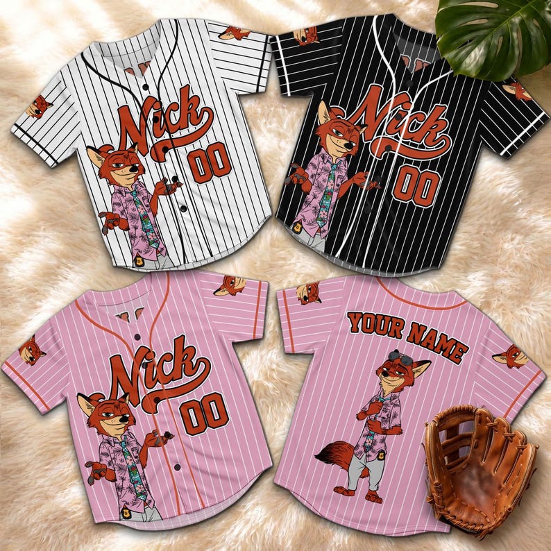 May include: Four baseball jerseys with a cartoon fox design. The jerseys are white with black pinstripes, black with white pinstripes, and pink with white pinstripes. Each jersey features the name "Nick" and the number "00". A baseball glove is also present.