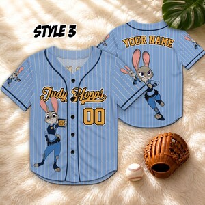 May include: Light blue baseball jersey with vertical white stripes, featuring the character Judy Hopps. The jersey has the text "Judy Hopps" and the number "00". A baseball glove and ball are also visible.