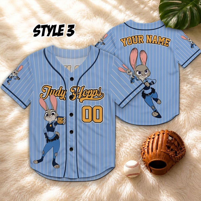 May include: Light blue baseball jersey with vertical white stripes, featuring the character Judy Hopps. The jersey has the text "Judy Hopps" and the number "00". A baseball glove and ball are also visible.