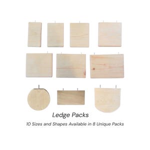 May include: A collection of ten light-colored wooden ledges in various rectangular, circular, and semi-circular shapes, each featuring metal mounting hardware. The text reads Ledge Packs, 10 Sizes and Shapes Available in 8 Unique Packs.