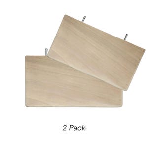 May include: A set of two rectangular light-colored wooden shelves, each featuring two metal mounting bolts protruding from the back edge. The shelves have a smooth, natural wood grain finish and are presented as a 2 Pack.