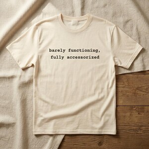 Barely Functioning Fully Accessorized t-shirt in Soft Cream