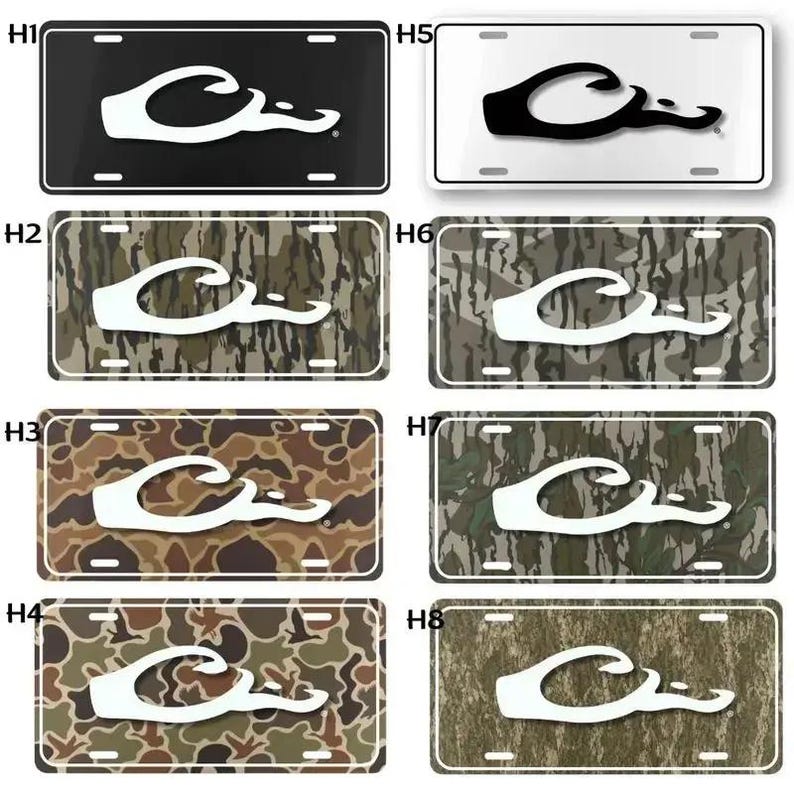 May include: License plates with a white logo on various backgrounds. The backgrounds include black, white, and camouflage patterns in shades of brown, green, and gray. The logo is a stylized duck.
