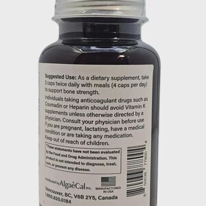 May include: A brown supplement bottle with a silver lid. The label includes text about usage and warnings. The bottle is filled with capsules and is manufactured in the USA.