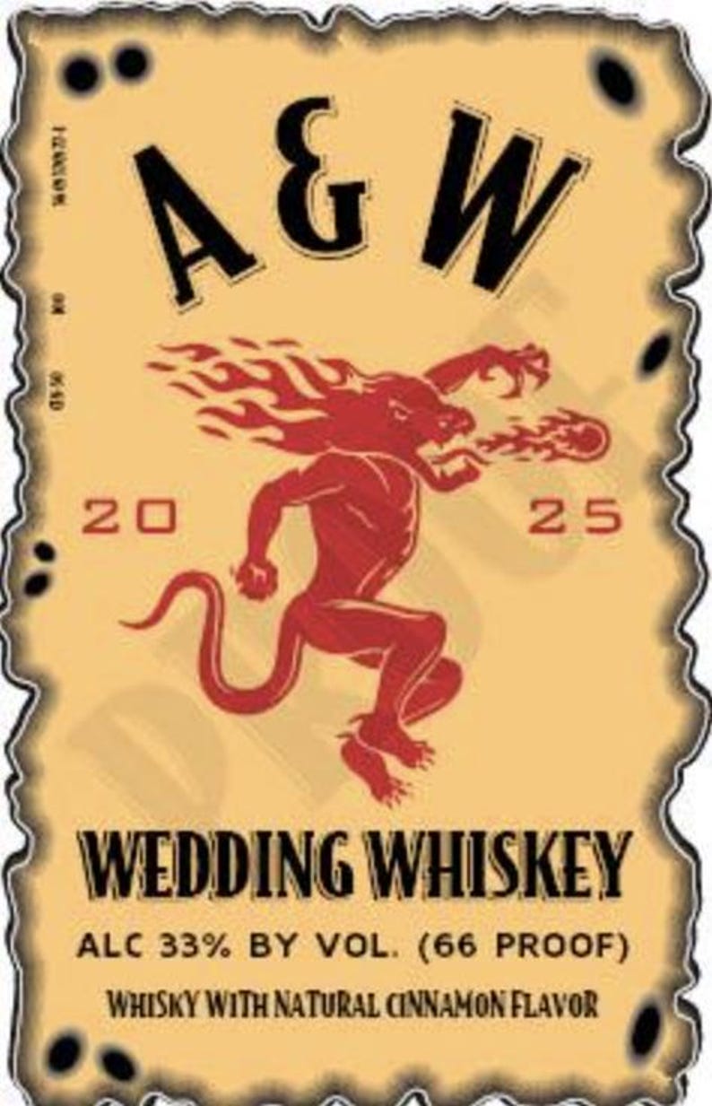 May include: A vintage-style label with a tan background and a decorative border. The label features the text "A & W" in black, a red illustration of a devil-like creature, and the words "WEDDING WHISKEY". The label also includes the text "20 25".