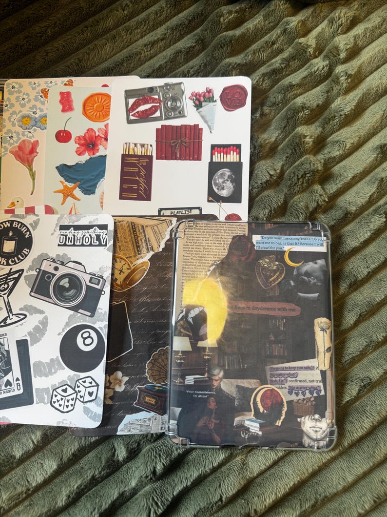 May include: A collection of decorative stickers and a phone case with a collage design. The stickers feature various illustrations, including a camera, lips, flowers, and an 8-ball. The phone case has a layered design with a vintage aesthetic.