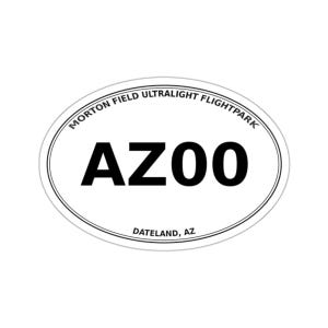 May include: An oval sticker with a white background and a thin black border. The text MORTON FIELD ULTRALIGHT FLIGHTPARK is printed in an arc at the top. The large black text AZ00 is centered, and DATELAND, AZ is printed at the bottom.