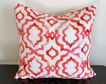 Pink, red and white geometric pillow cover