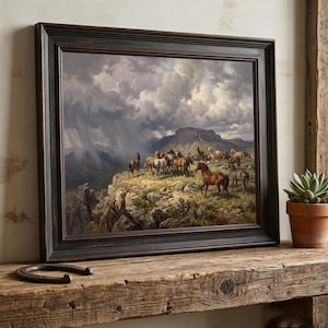 May include: A framed landscape painting depicting a herd of horses standing on a rocky cliffside under a dramatic, stormy sky with rain showers in the distance. The artwork is enclosed in a dark, distressed wooden frame with a classic profile.