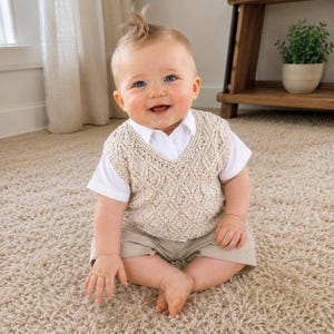 May include: A beige knitted vest with a diamond cable pattern worn over a white short-sleeved collared shirt and beige shorts. The vest features a V-neckline and intricate textured stitching throughout the front, providing a layered appearance.