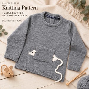 May include: A grey long-sleeve knitted jumper featuring a square pocket with a white mouse appliqué peeking out. The text reads: Digital Product Knitting Pattern Toddler Jumper With Mouse Pocket Size 1-2 (3-4: 5-6) Years. Includes a navy blue collar.