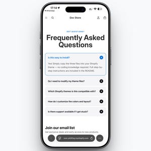 May include: A smartphone displays a "Frequently Asked Questions" page from a Shopify store. The screen shows questions about installation, theme modification, compatibility, customization, and support. The phone is black with a white screen.