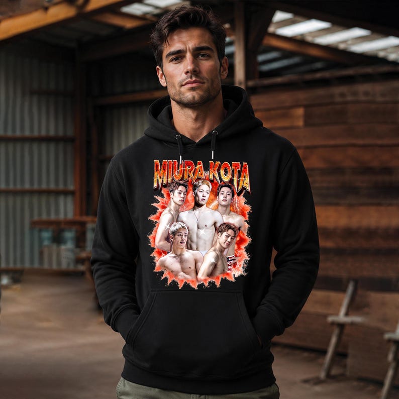 May include: Black hooded sweatshirt featuring the text "MIURA KOTA" in a retro style, with a graphic of a group of shirtless men. The sweatshirt has a drawstring hood and a front pocket.