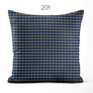 May include: A square throw pillow featuring a dark blue base with a repeating grid pattern of thin, light tan horizontal and vertical lines. The number 201 is printed in black at the top center of the image, positioned above the pillow.