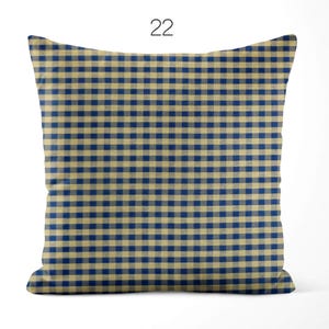 May include: A square throw pillow featuring a classic navy blue and beige gingham check pattern. The design consists of a repeating grid of small, uniform squares across the entire surface. The number 22 is printed in black above the pillow.