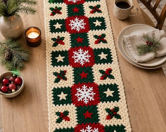 May include: A rectangular crochet table runner featuring a repeating pattern of cream, dark green, and red squares. The design includes white snowflake motifs, small beige stars, and red berry clusters. The runner is crafted with a textured yarn finish.
