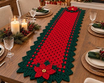 May include: A rectangular crochet table runner featuring a vibrant red center with a grid pattern, bordered by a dark green scalloped edge. Large, three-dimensional red poinsettia flowers with yellow centers are attached to both ends.